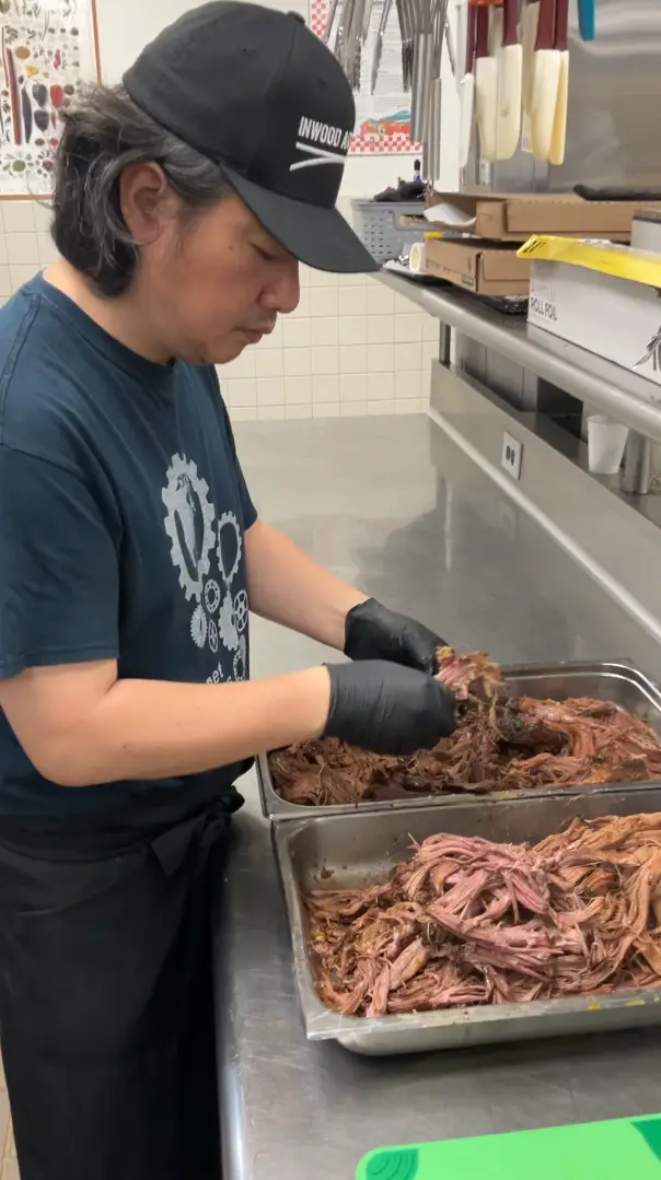 Shredding the braised brisket for our West African Brisket Pot Pie.