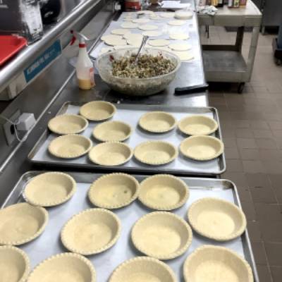 Beef pot pies getting ready to be filled before going in the oven.”